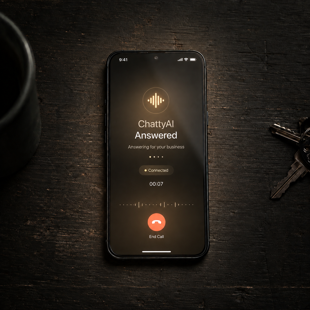 A phone on a dark table. The screen reads: ChattyAI answered, answering for your business, connected.